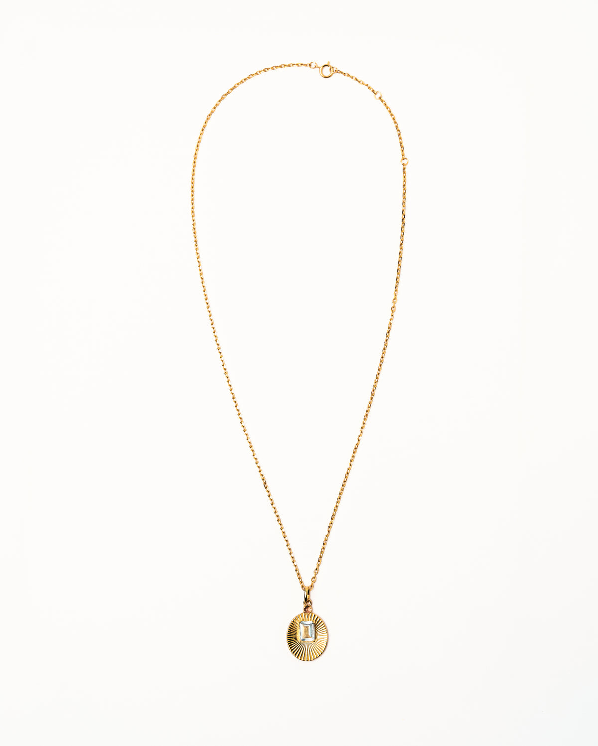Full view of VERAE blue topaz and tourmaline pendant necklace