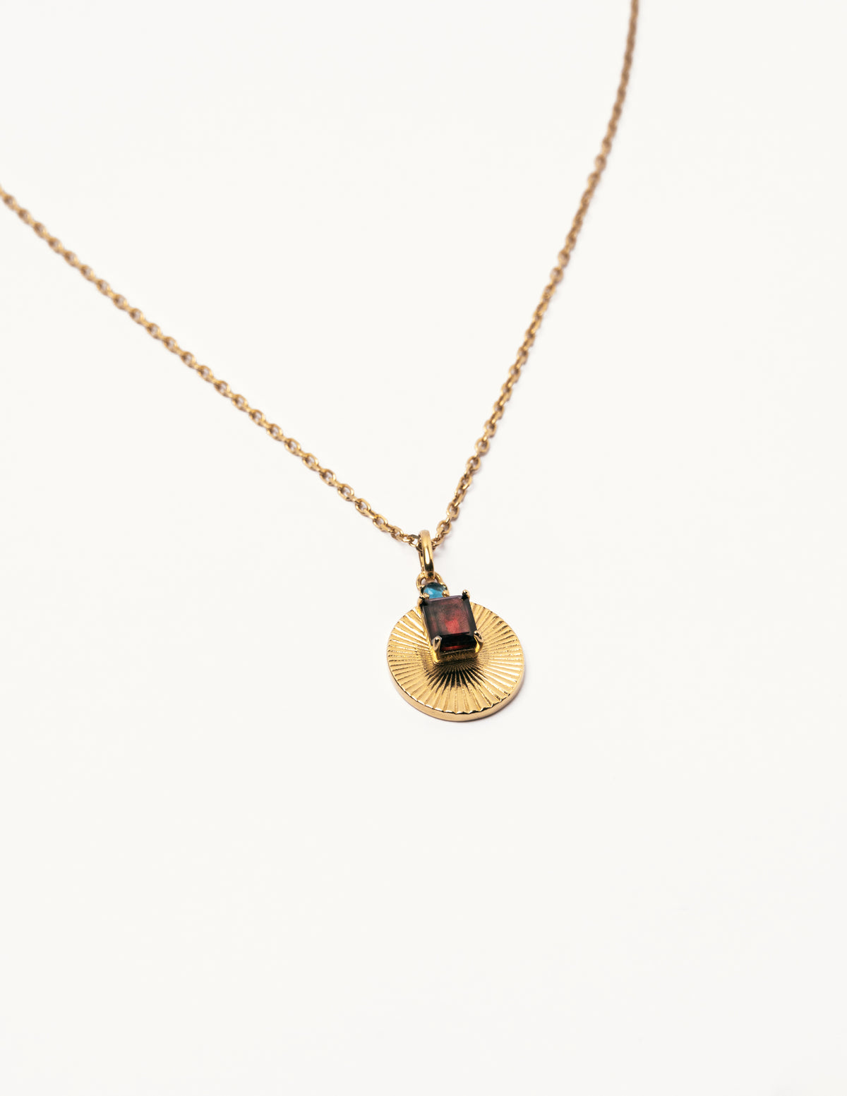 Garnet and blue topaz pendant necklace by VERAE