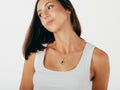 Model wearing VERAE iolite and smoky quartz necklace