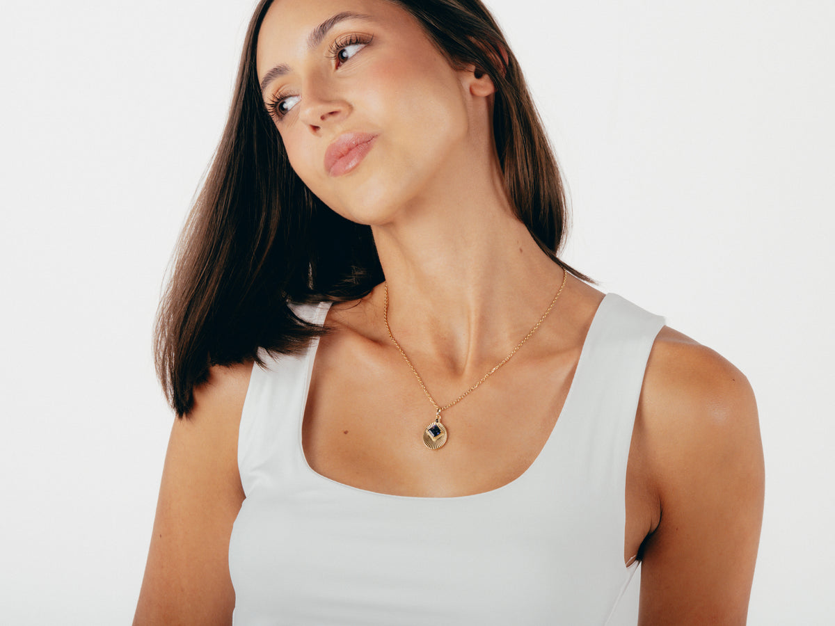 Model wearing VERAE iolite and smoky quartz necklace